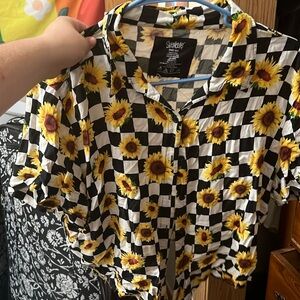 Spencer’s checkered daisy shirt